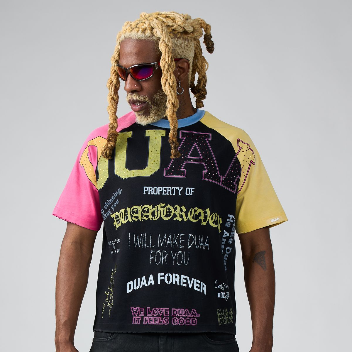 Men's graphic university tee with black front and multicolor sleeve text print