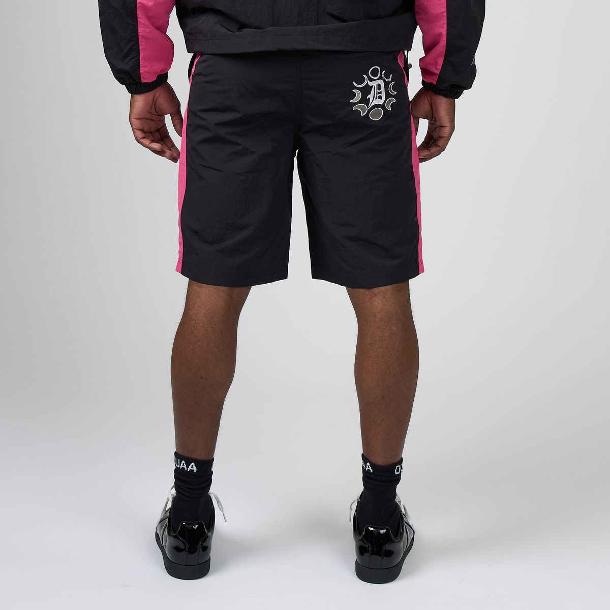 Men's DUAA digital shorts, black with pink stripes and white graphic logo on thigh
