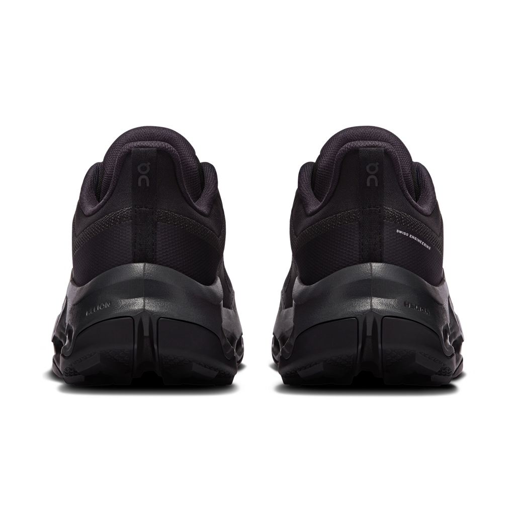 Women's waterproof running shoes black, rear view with padded collar and heel