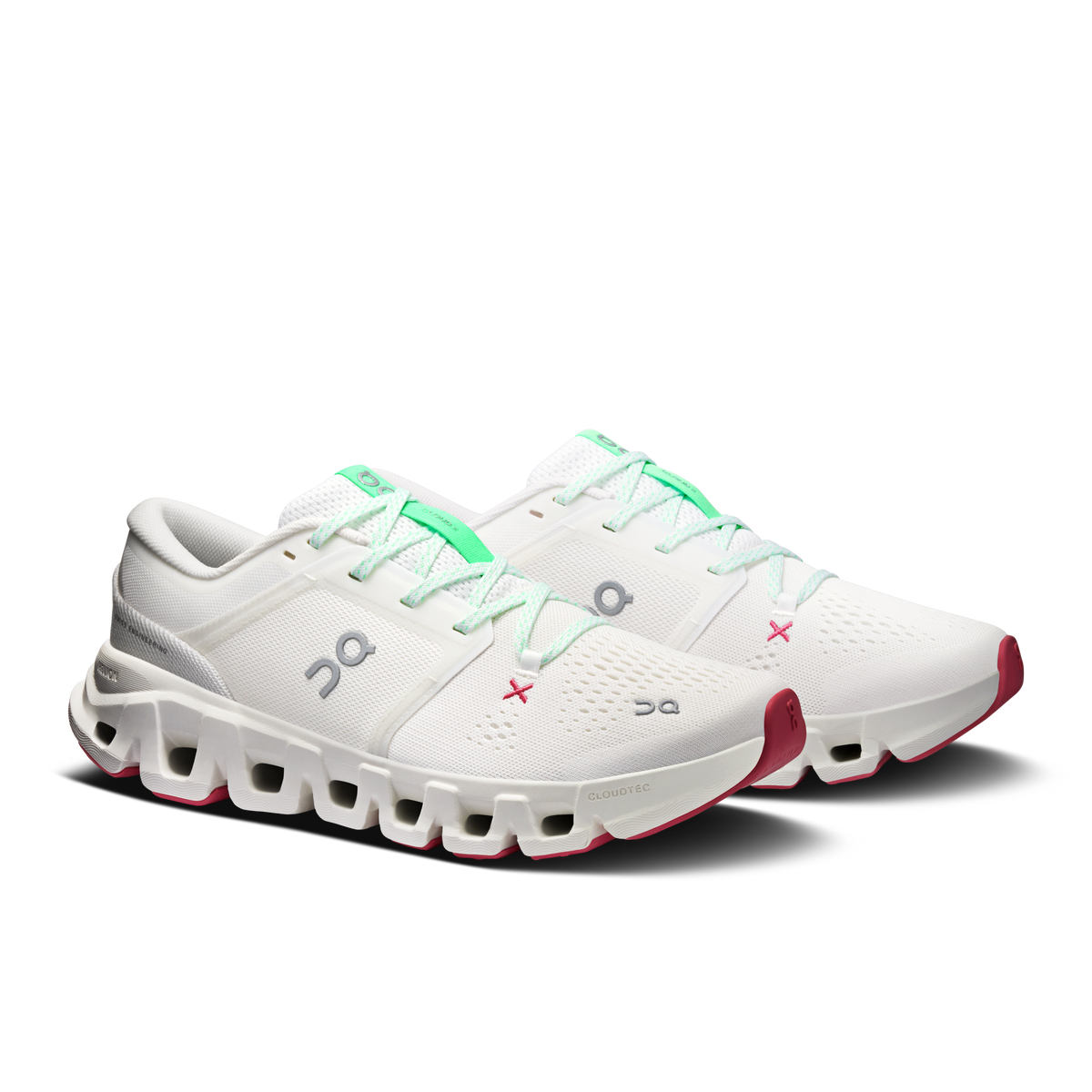 Women's ivory running shoes with mint laces and red side outsole pods