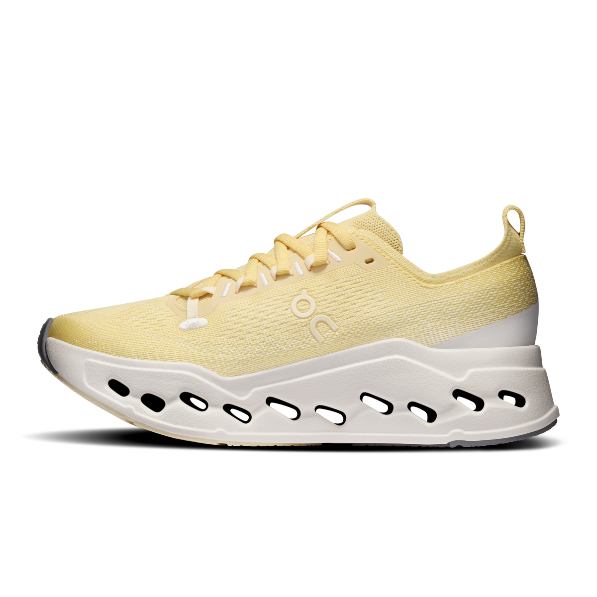 Women's yellow running shoe with lace-up closure and white sole with black slots