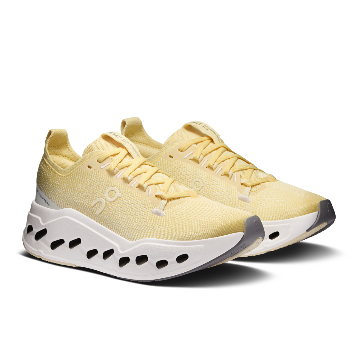 Women's yellow running sneakers with lace-up front and white rocker sole