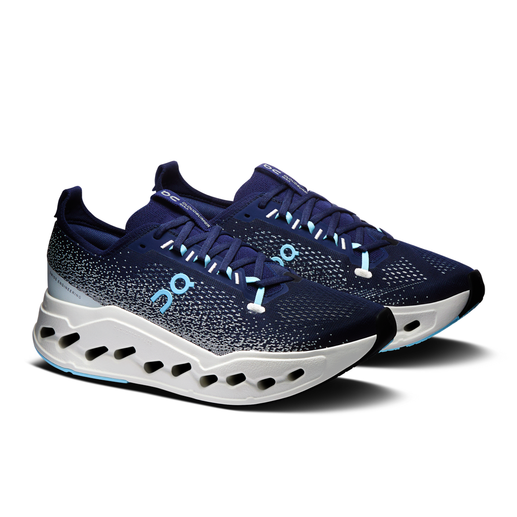Men's running shoes, dark navy speckled upper, white sole with oval cutouts