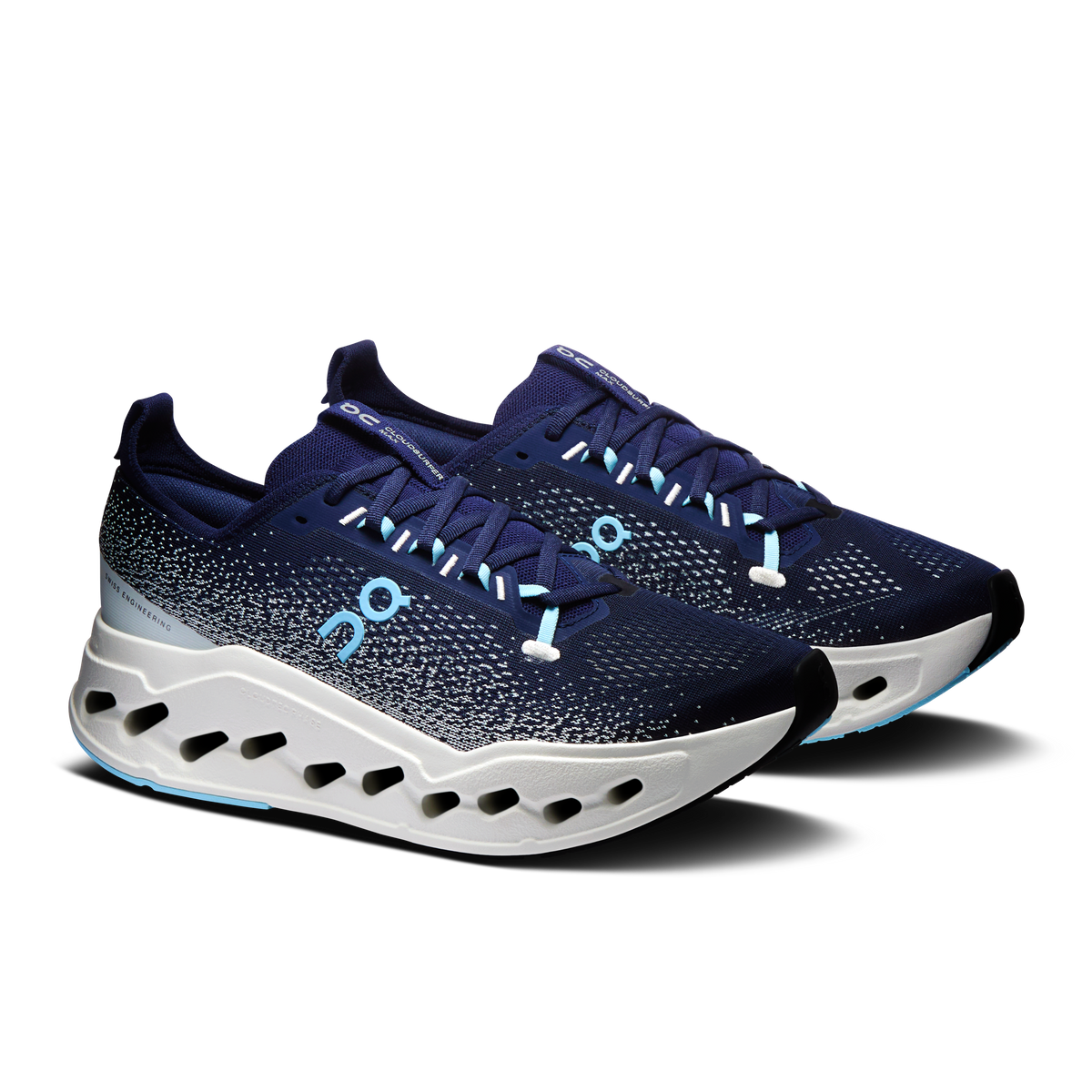 Men's running shoes, dark navy speckled upper, white sole with oval cutouts