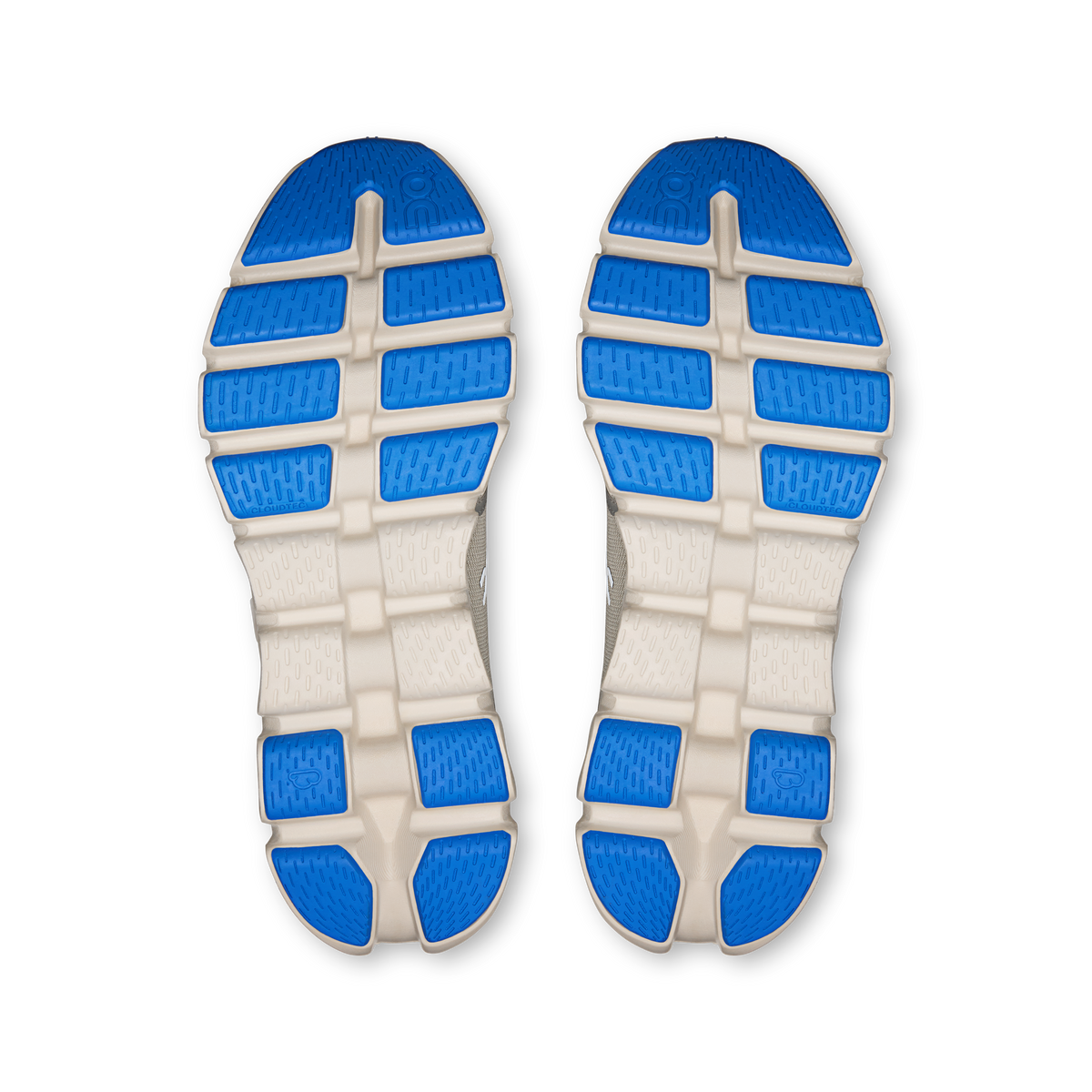 Shoe outsole tread with blue rubber pods and white traction blocks