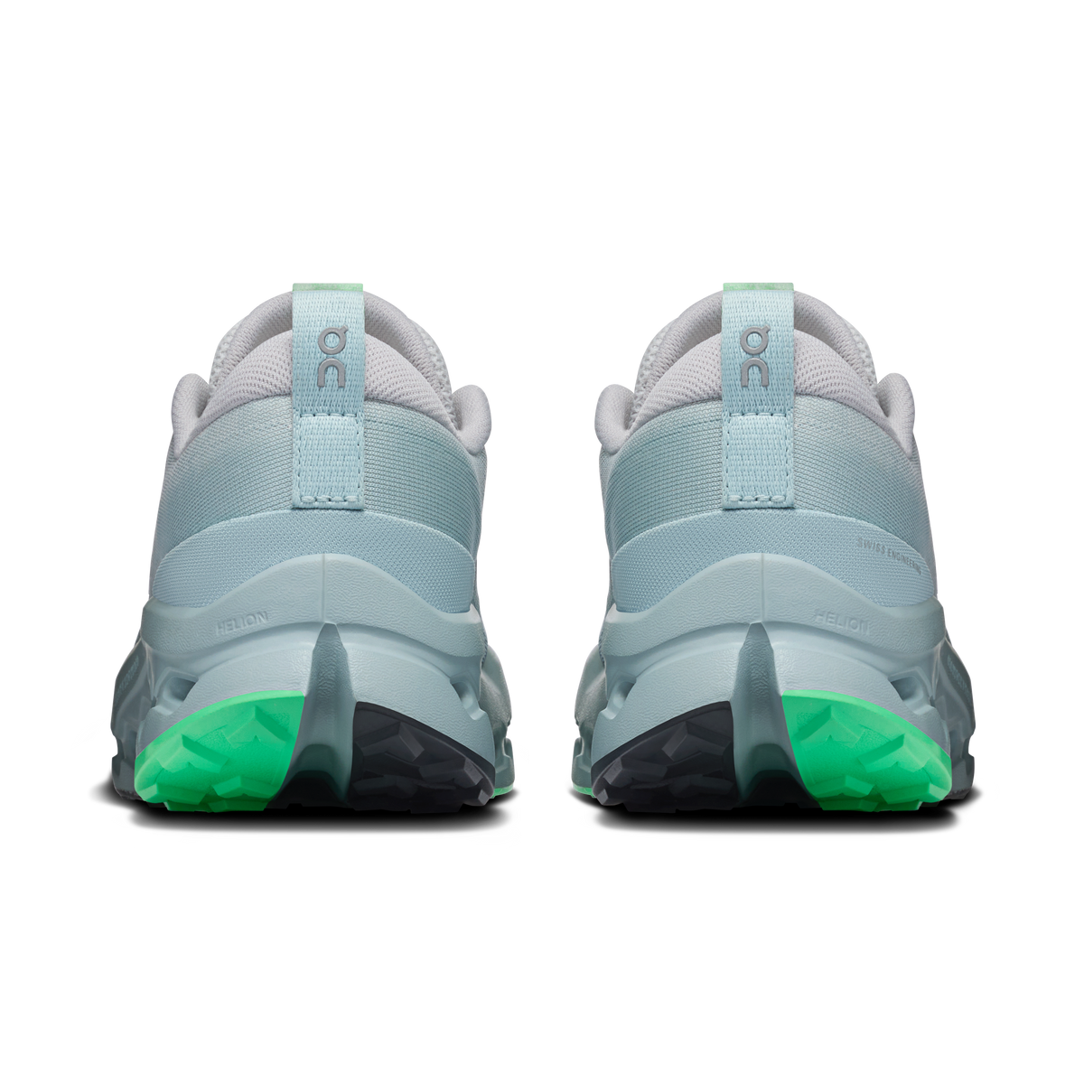 On women's trail shoes, heel view, light blue back with green outsole and pull tab