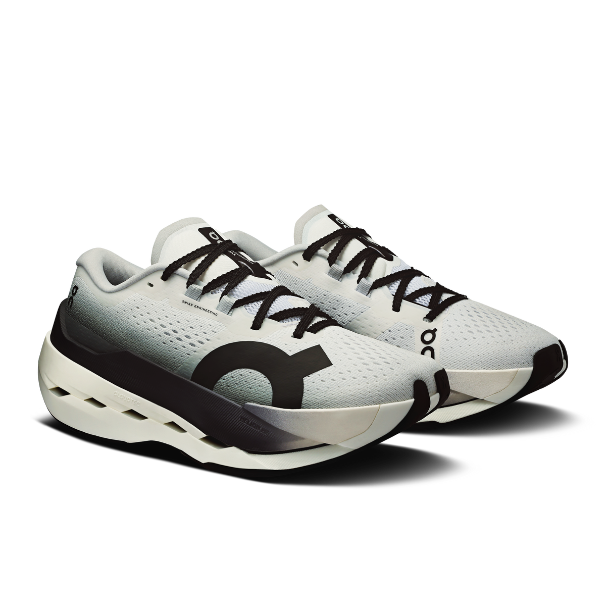 Women's On running shoes with white mesh upper, black accents, and logo on the side