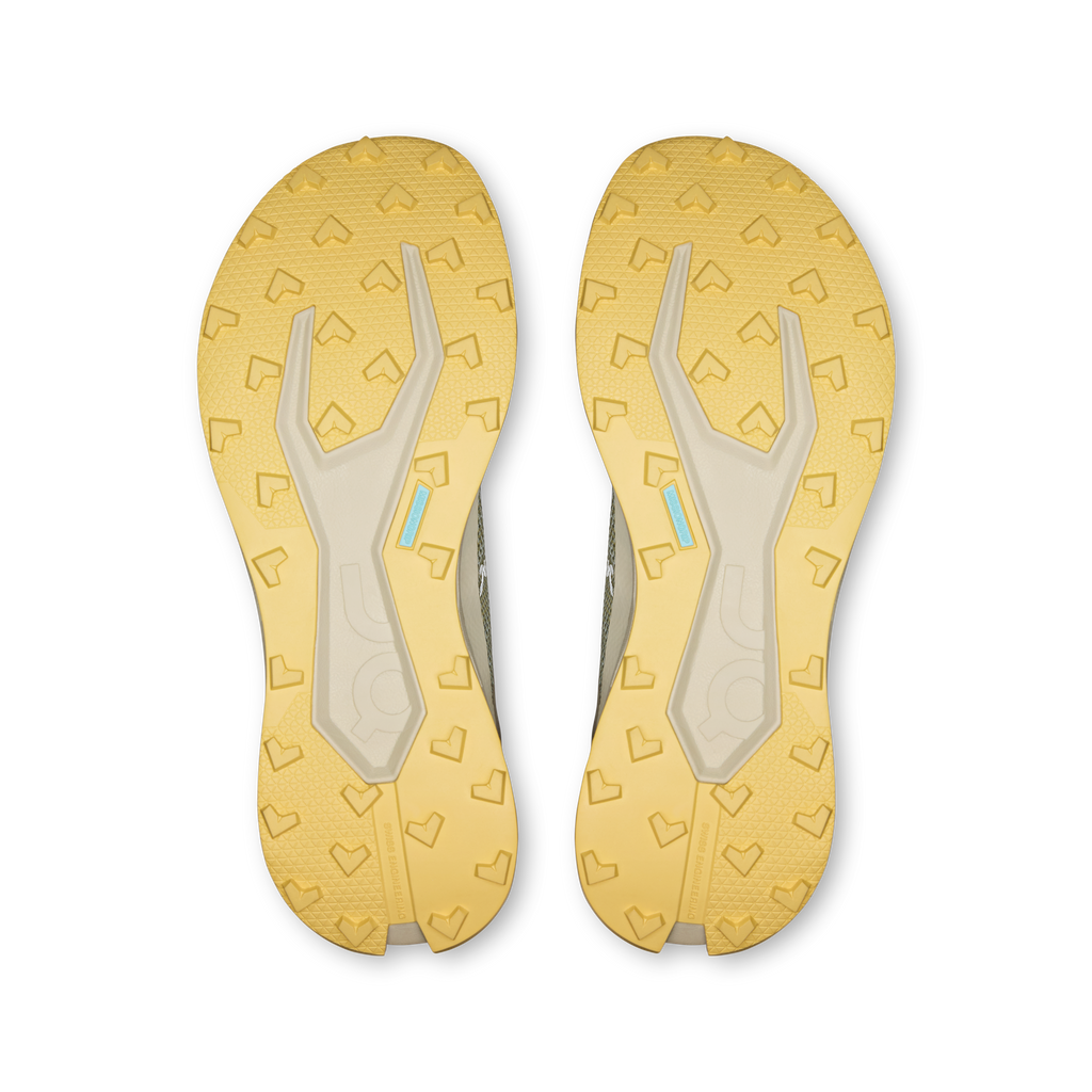 Pair of shoe outsoles with patterned tread and light gum rubber