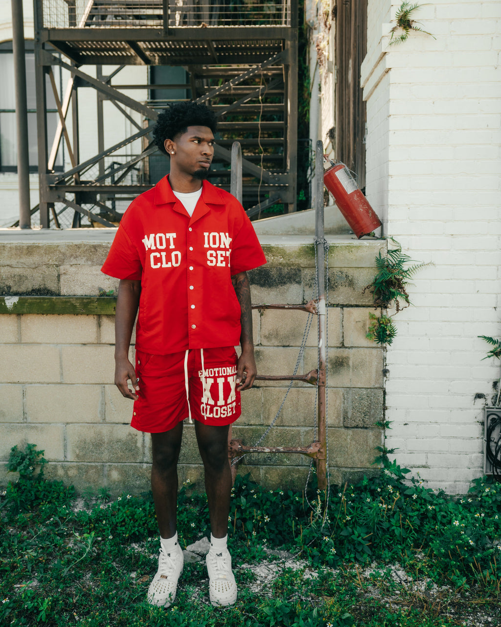 Red men's nylon shorts, side snaps and eyelets, printed logo on front hem