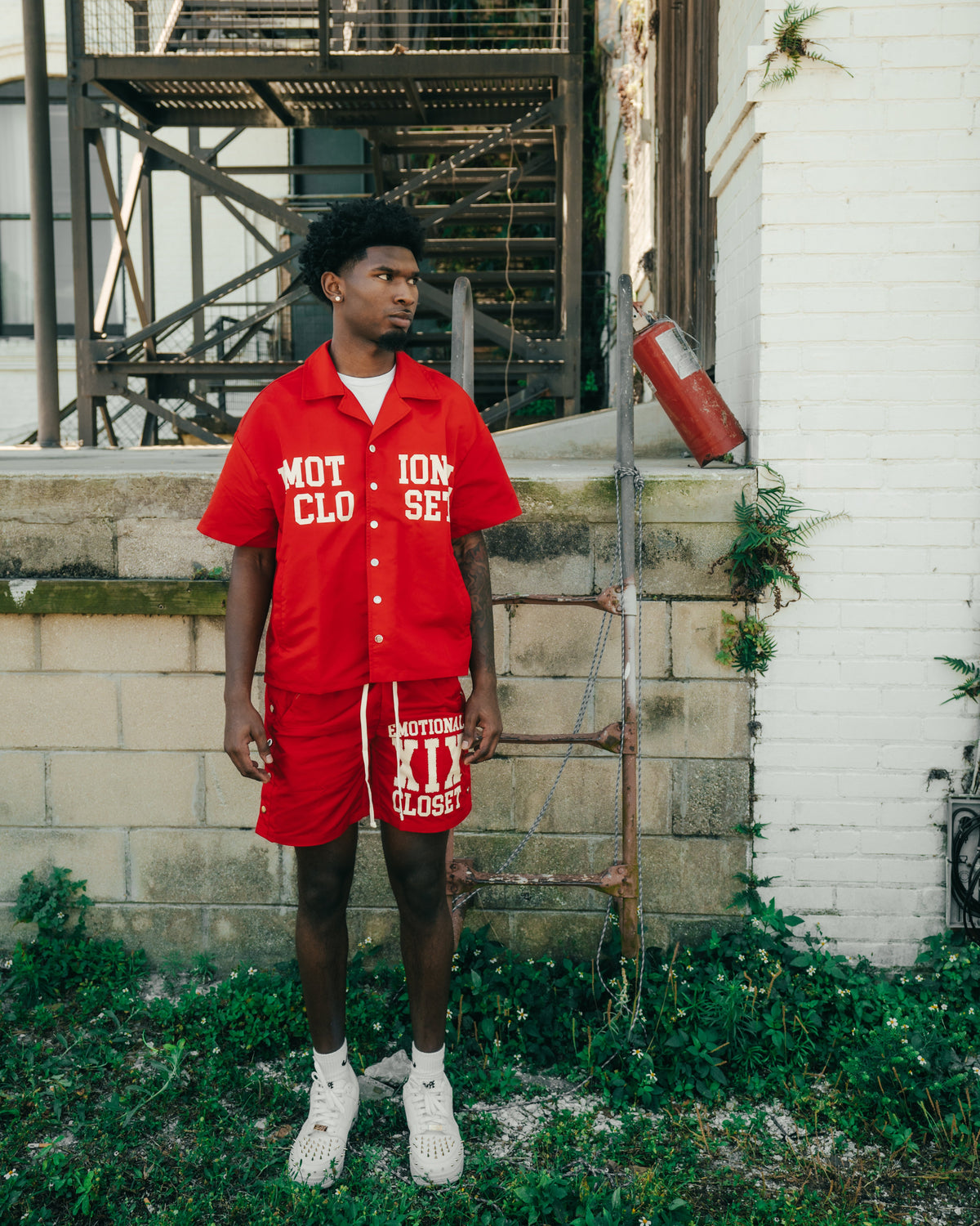 Red men's nylon shorts, side snaps and eyelets, printed logo on front hem