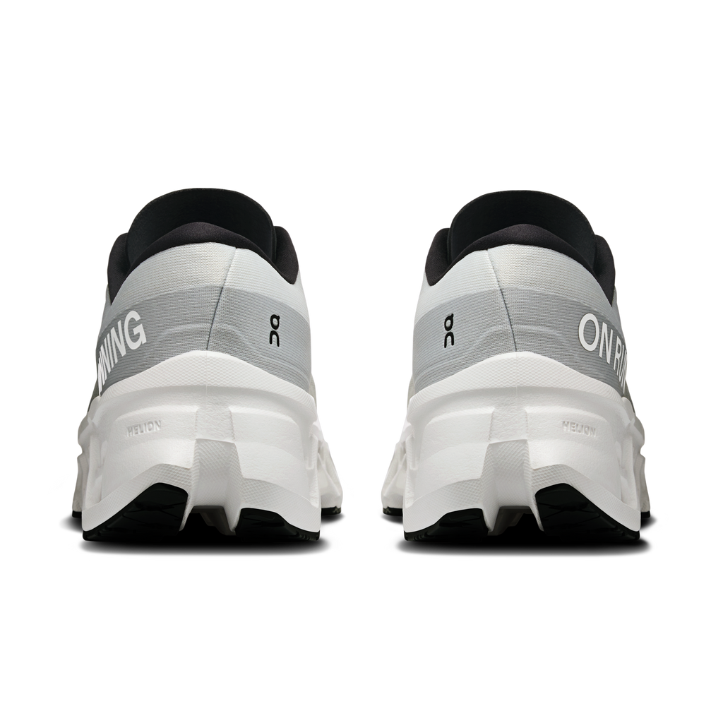 Women's white running shoes, heel view, black collar lining and cushioned heel