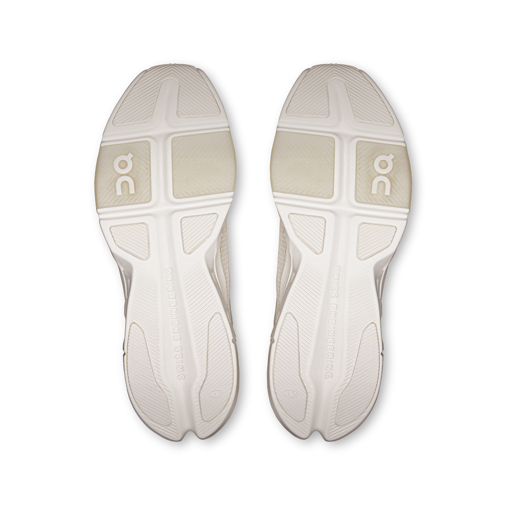 Pair of white outsoles with On logo traction pattern