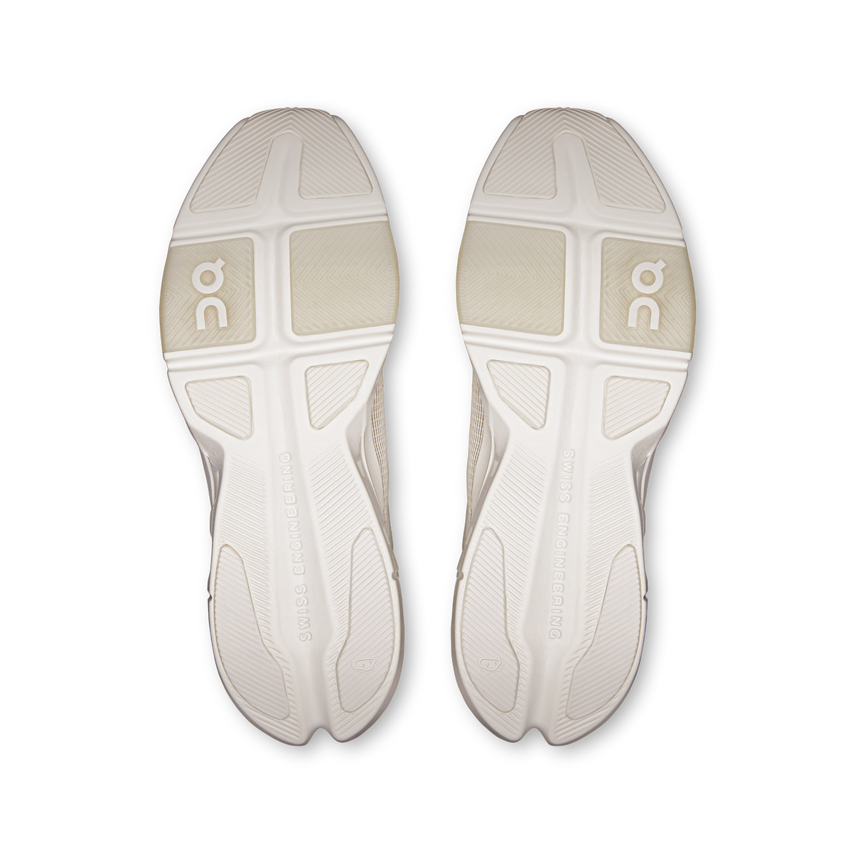 Pair of white outsoles with On logo traction pattern