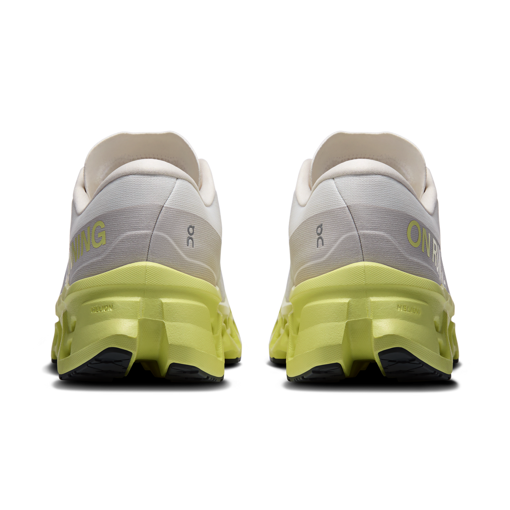Men's ivory running shoes, heel view with neon-lime cushioning and rear pull tab