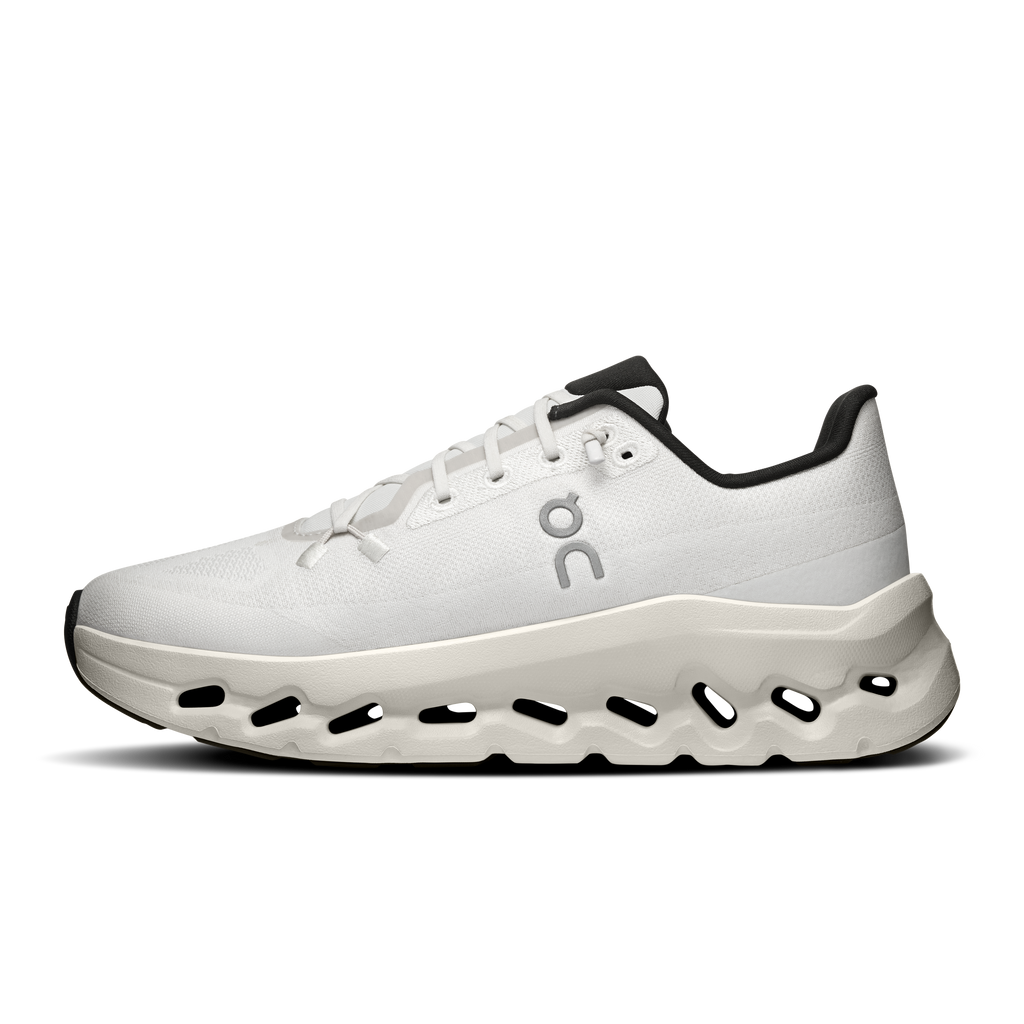 Women's running shoes with white upper, laces, and cushioned sole