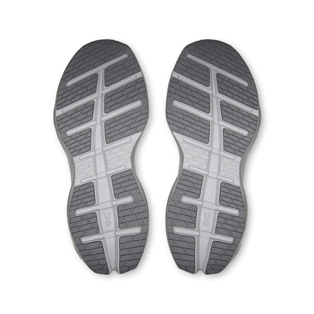 Pair of shoe outsoles with grippy tread and segmented cushioning channels