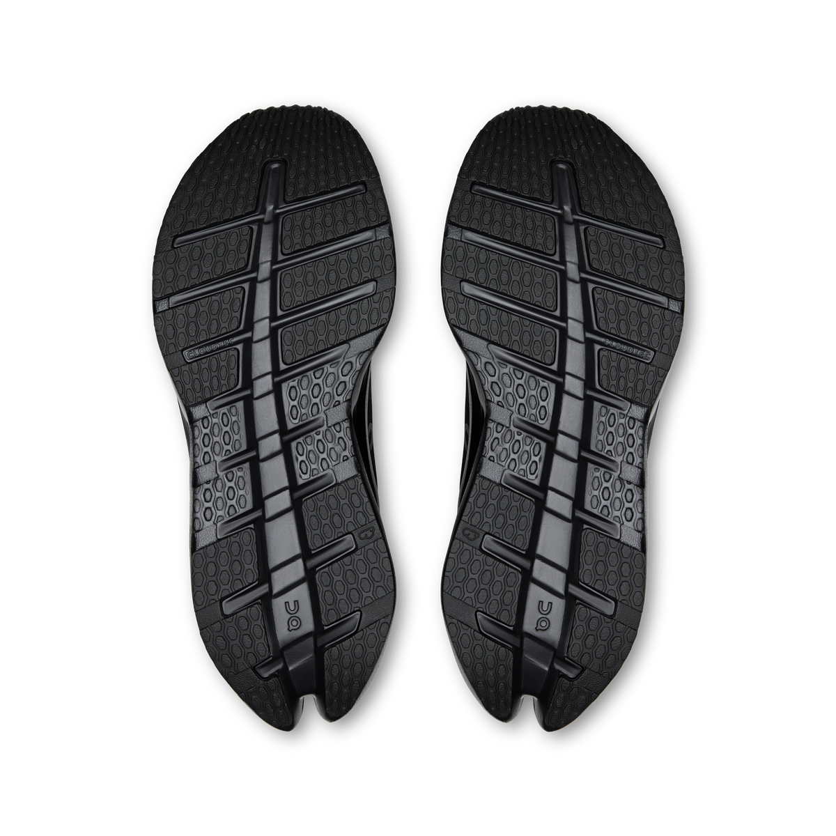 Black running shoe outsoles with grippy tread pattern, heel-to-toe coverage