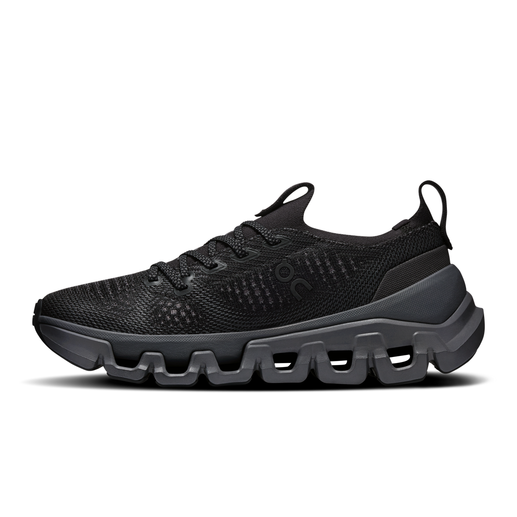 Black knit lace-up running shoe with rounded toe, cushioned midsole, and grippy sole