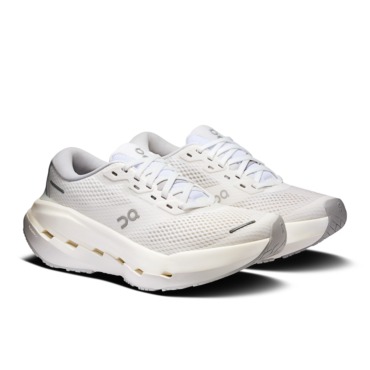 Women's running shoes, side view in white with lace-up and gray details