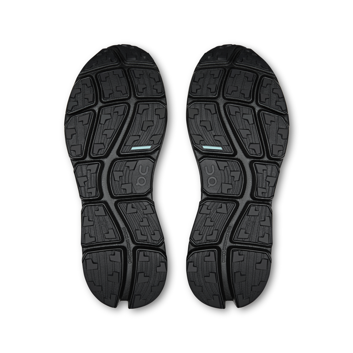 On men's black shoe outsoles with patterned tread and logo details