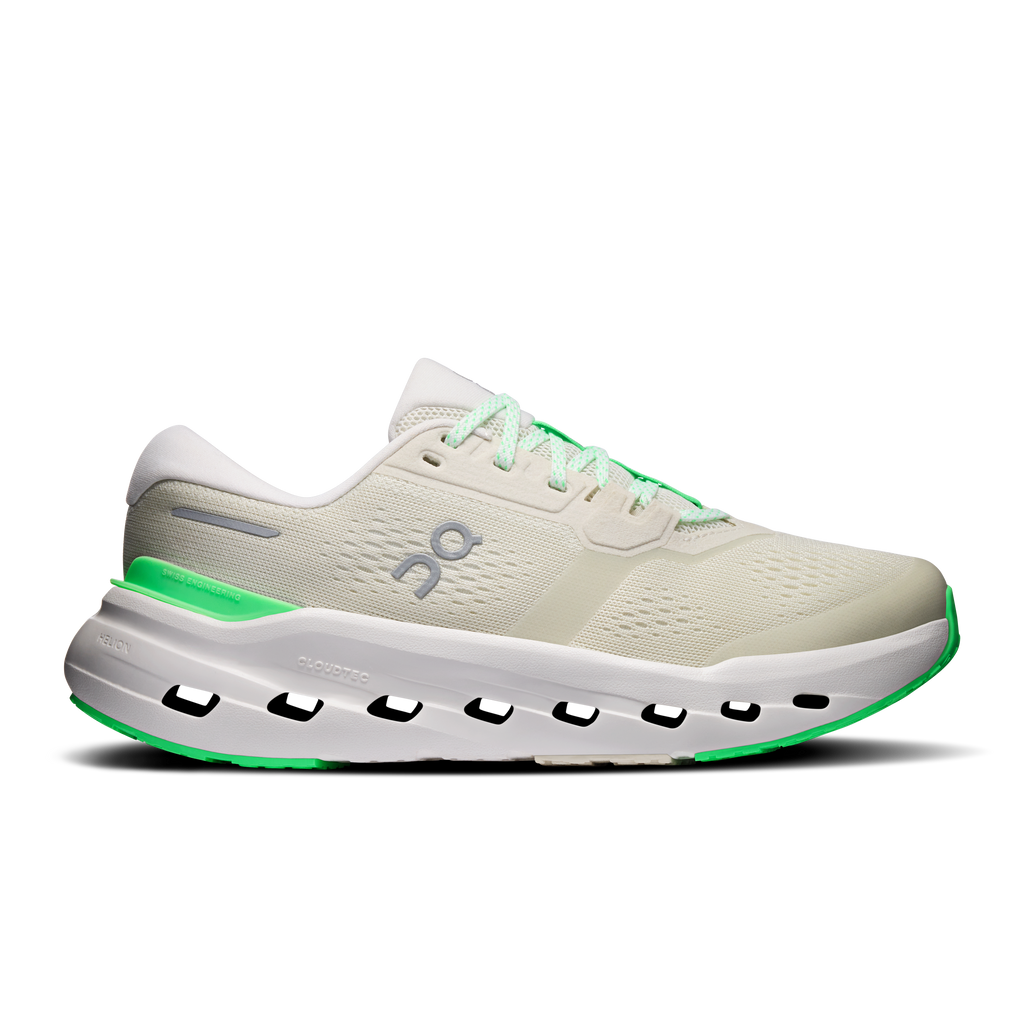 Women’s wide running shoes in off-white with neon green laces and trim, podded sole