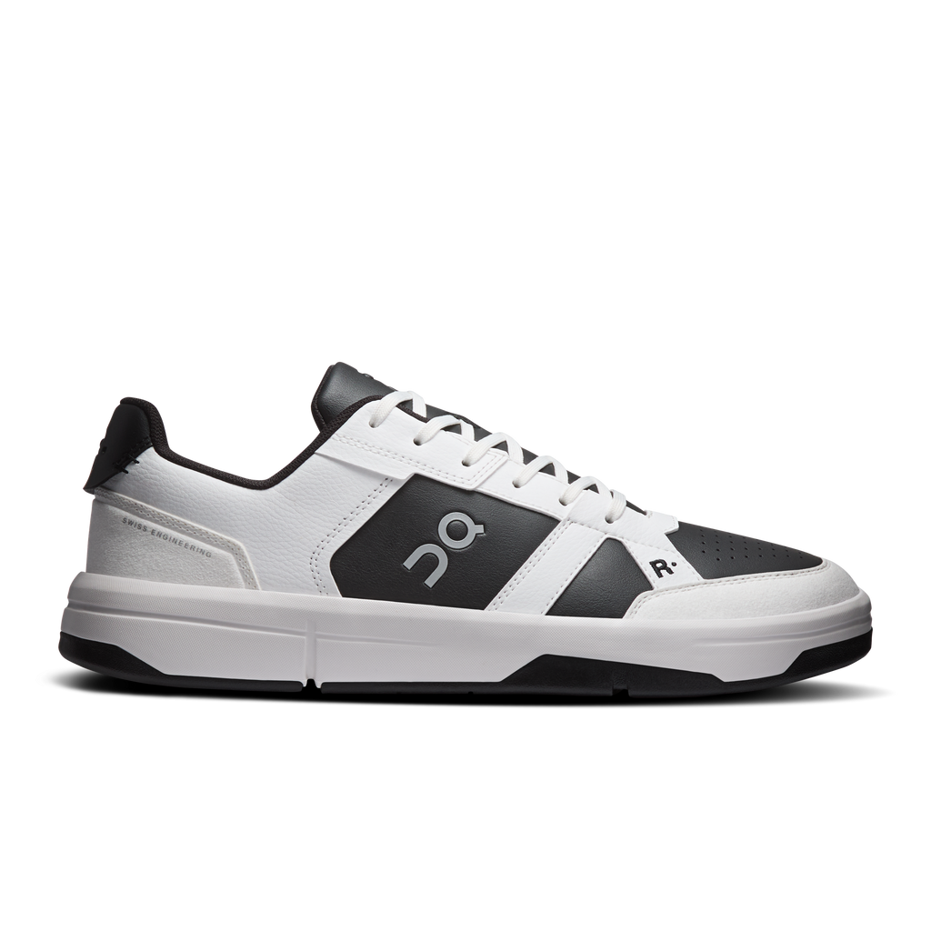 Men's white and black low-top leather sneakers with lace-up closure and logo accents