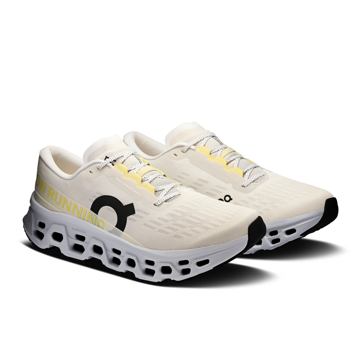 Pair of Men's On running shoes, light beige uppers with black accents and pod outsole