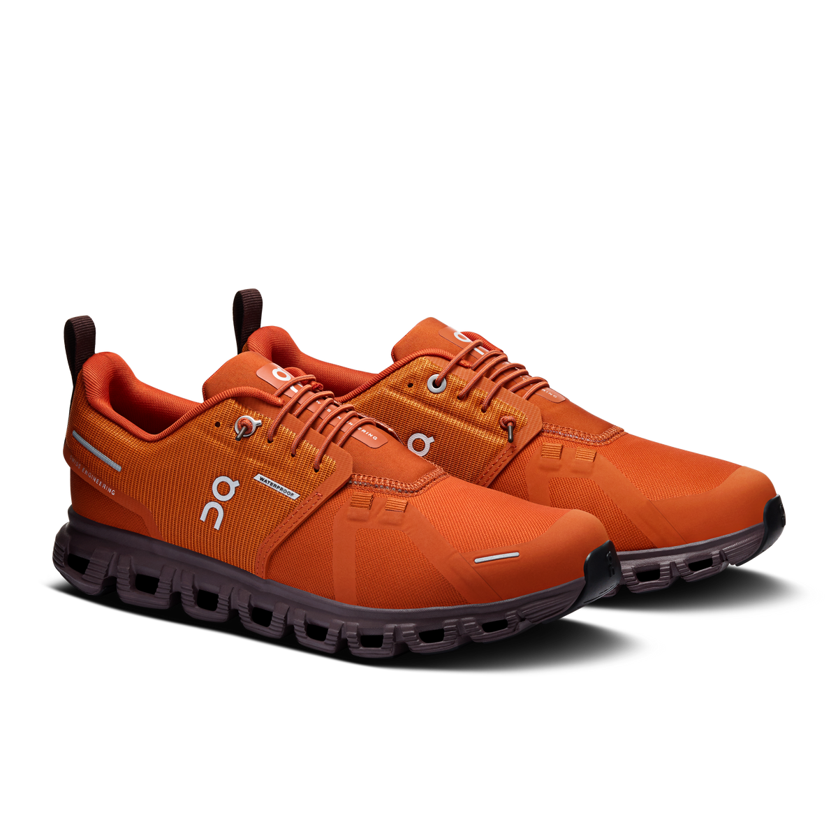 On women's waterproof running shoes, cinnamon/orange, angled side view with lace-up