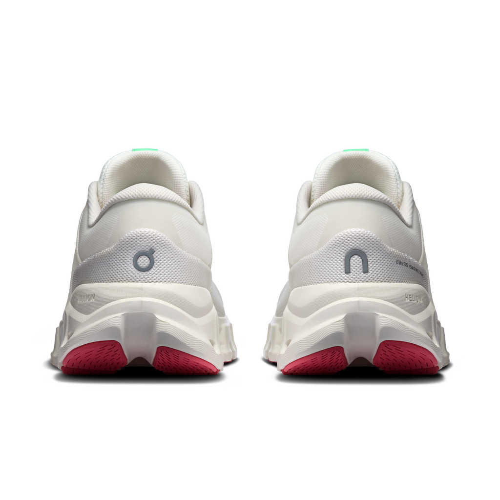 Women's ivory running shoes, rear view with red heel pods and cushioned collar