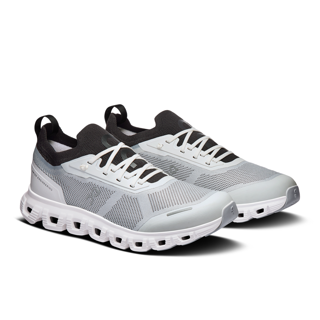 Women’s white/black lace-up running sneakers, side view with CloudTec cushioning
