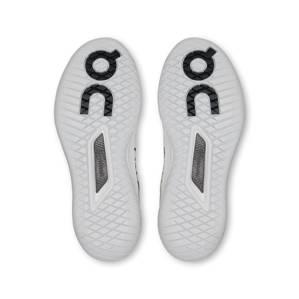 White shoe outsoles with textured tread and gray reinforced panels