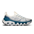 Women’s running shoes with white mesh upper, blue side panels, cushioned tread sole