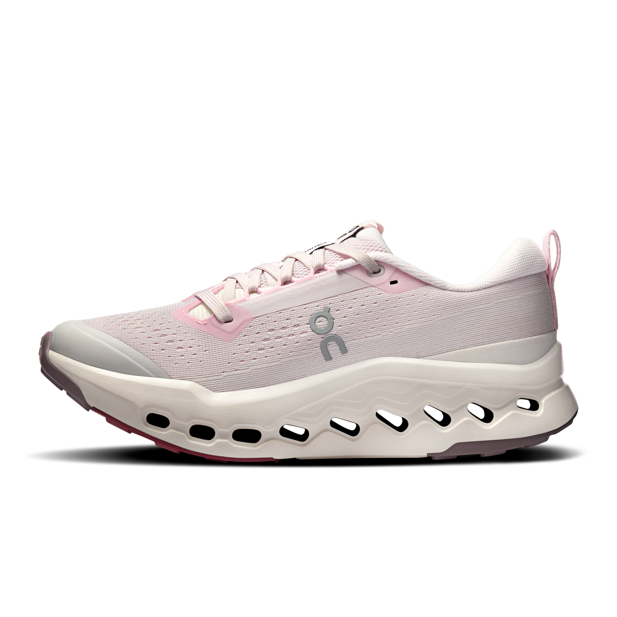 Light pink trail running shoe with lace-up mesh upper and white sole with cutout pods