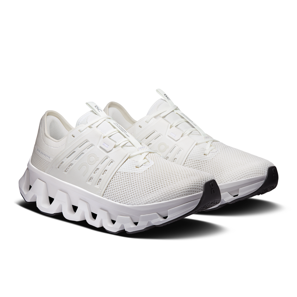 Men's white lace-up running shoes, side view with padded collar and CloudTec sole