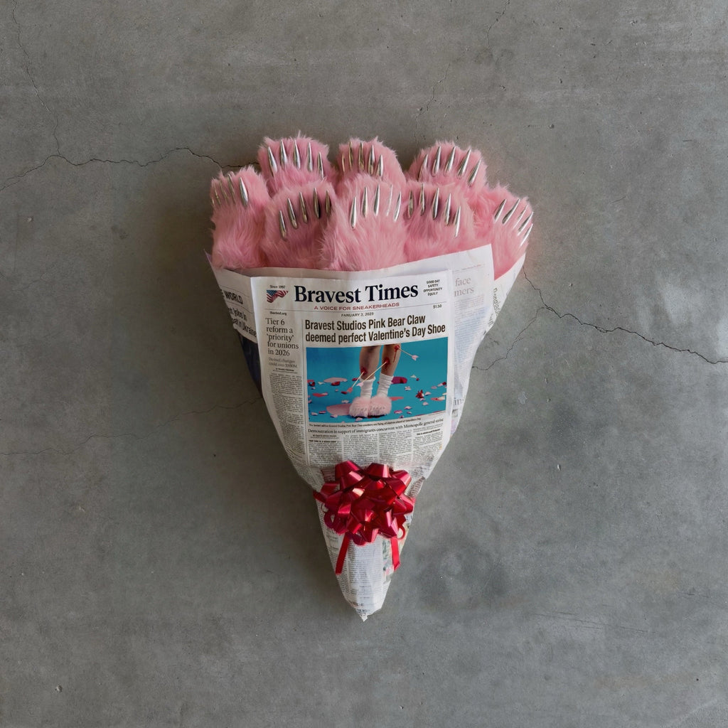 Pink bear claw mules in gift bag with red bow, plush claw openings