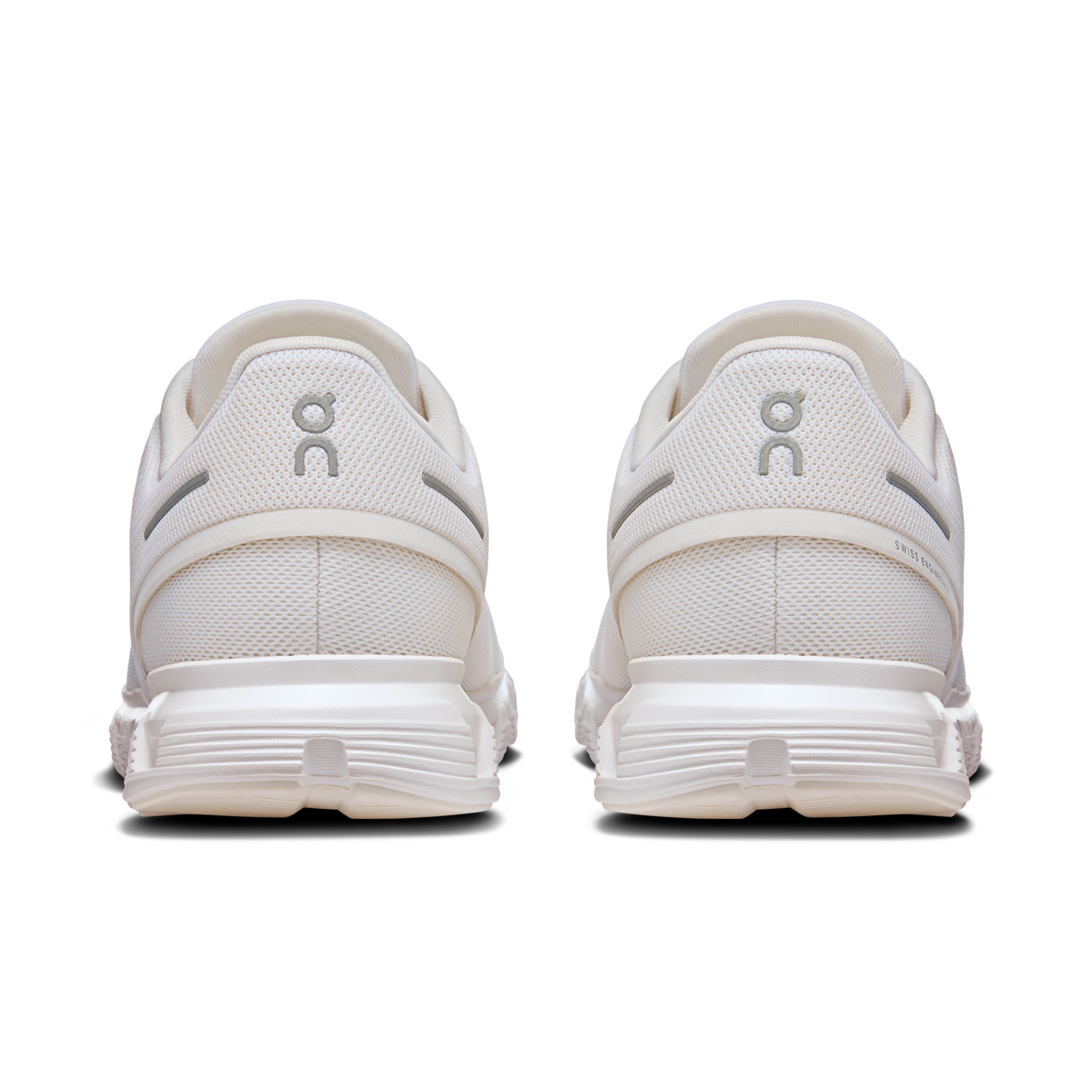 White rear view running shoes with padded heel collar and back logo tab