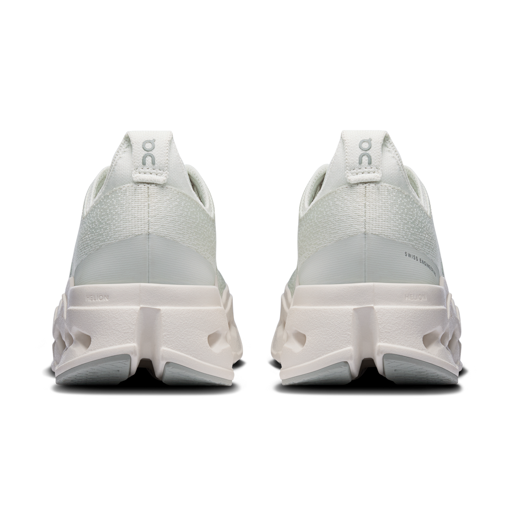 On women's running shoes, heel view with light mint upper and cushioned sole