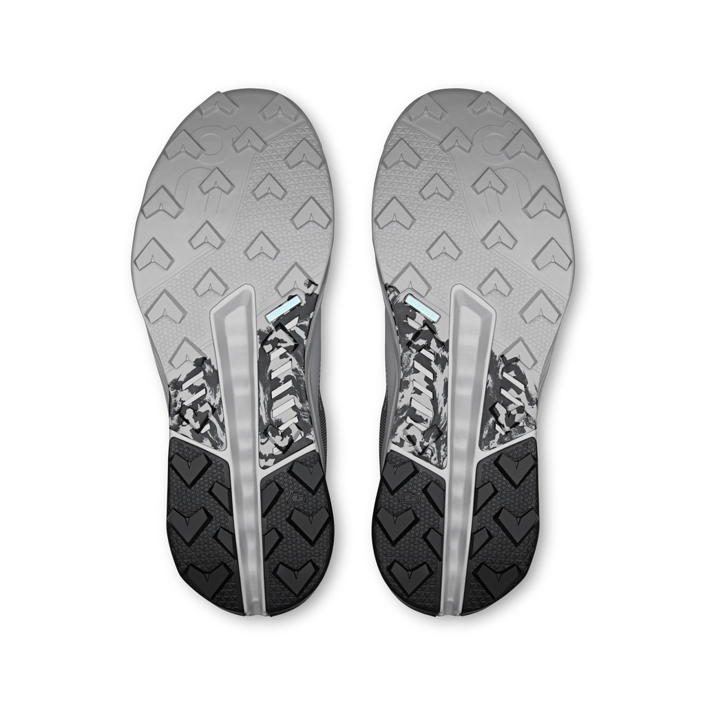 Men's waterproof running shoe outsoles, textured tread on gray rubber bottoms
