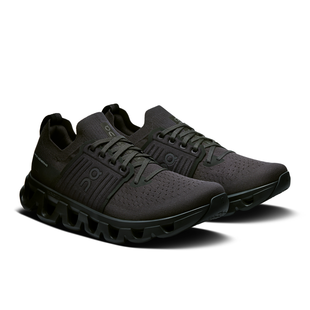 Men's lace-up running shoes in dark black with textured knit panels