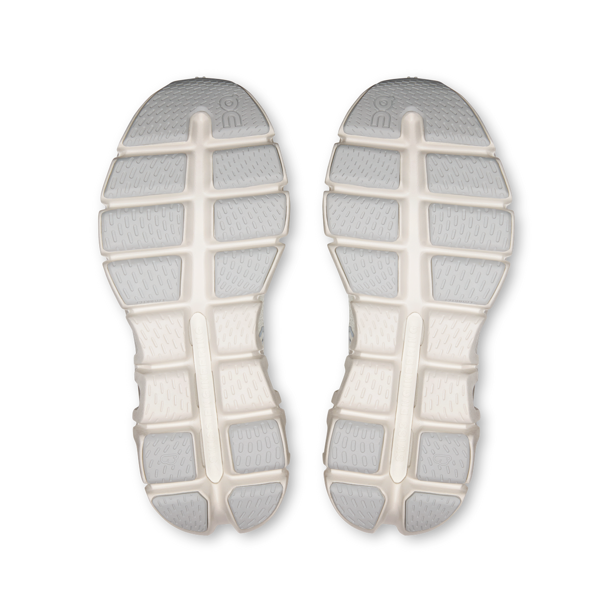 Pair of shoe outsoles with white rubber tread, center cross and segmented lugs
