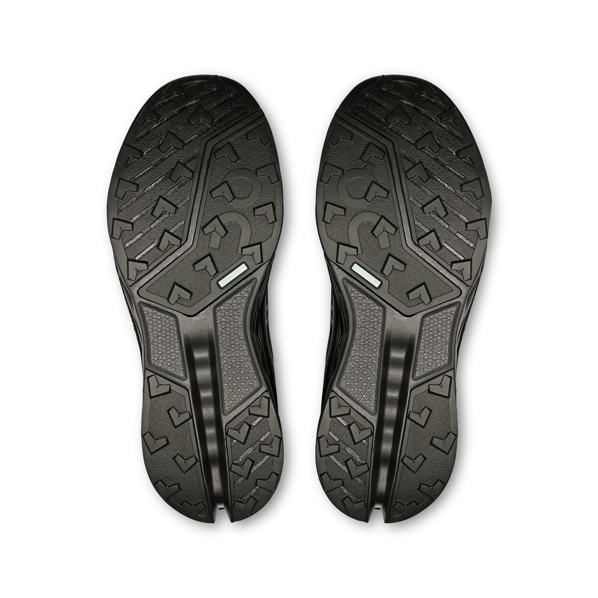 Women’s black trail shoe outsoles, textured tread with curved rubber grooves