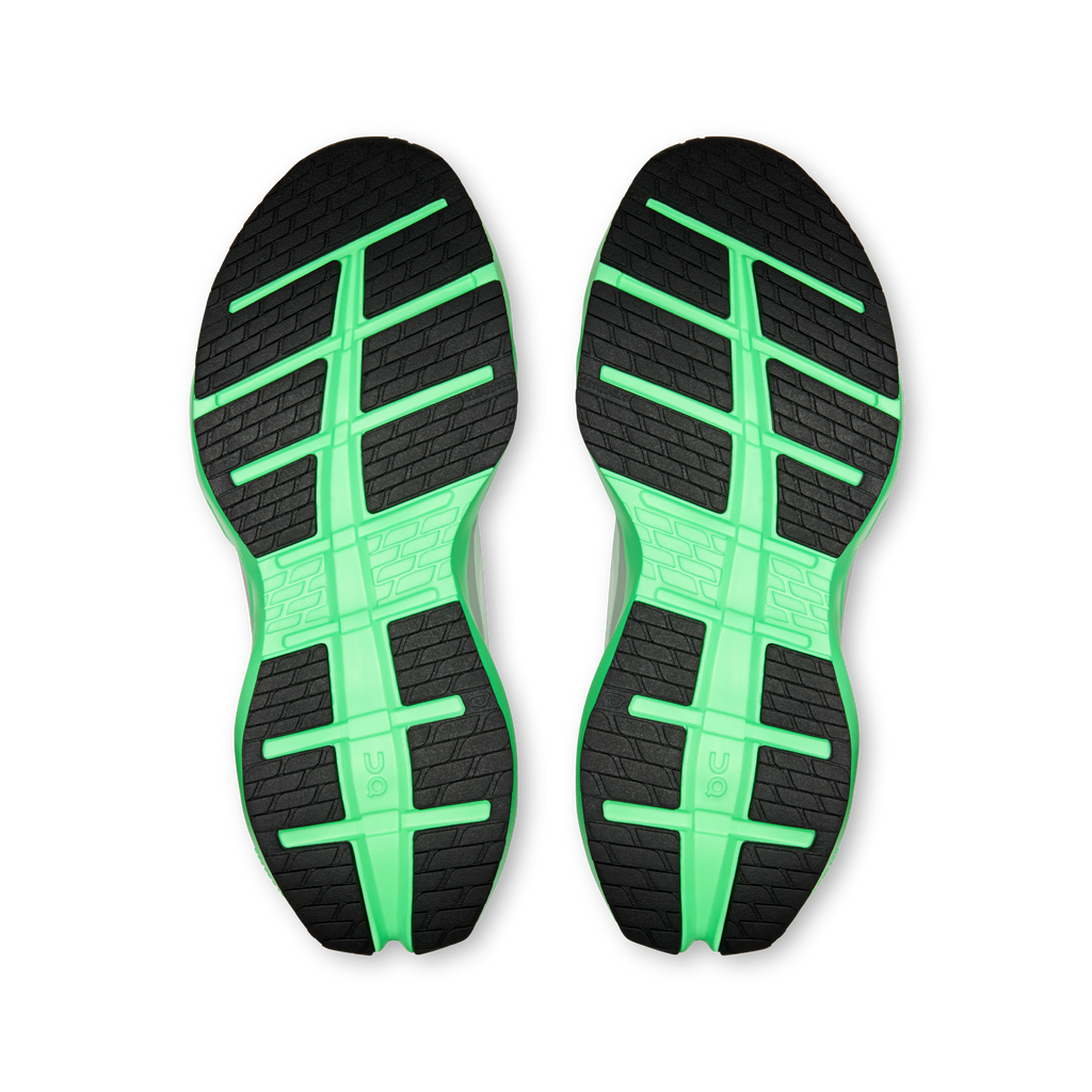Shoe outsole view: black tread with bright green cross and stripe pattern