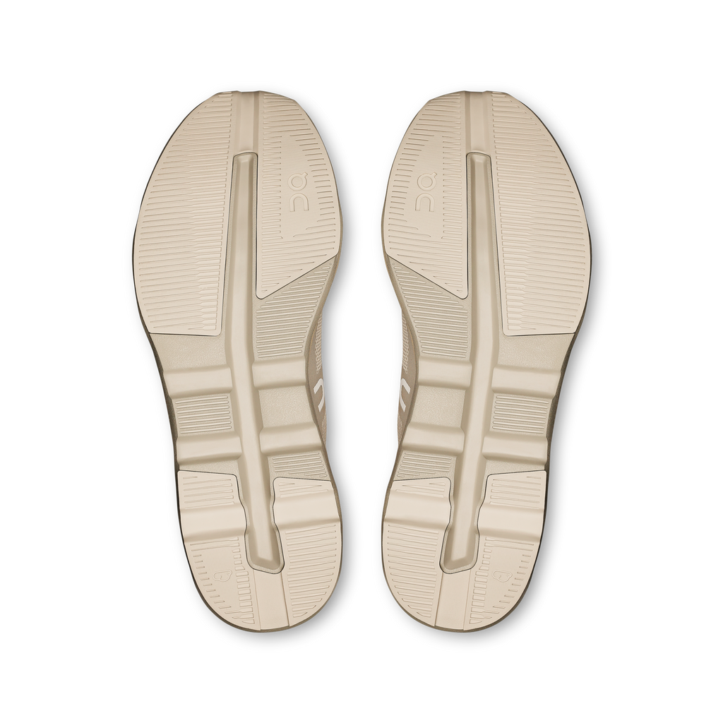 On Cloudzone shoe outsoles in light cream with textured traction tread