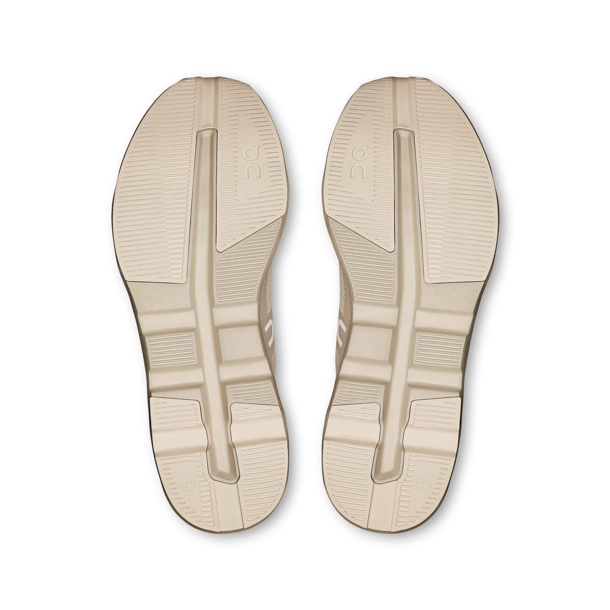 On Cloudzone shoe outsoles in light cream with textured traction tread