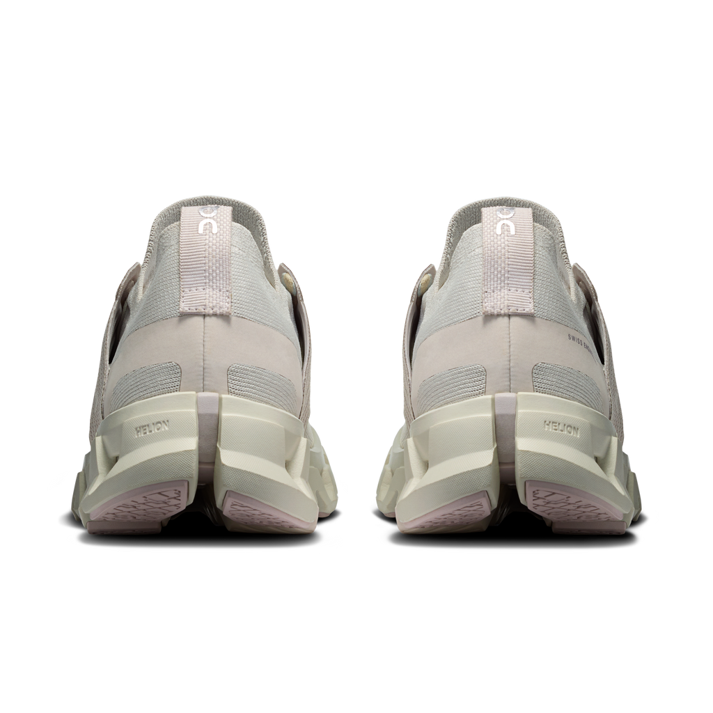 Women’s running shoes heel view in light gray with white midsole and cushioned back