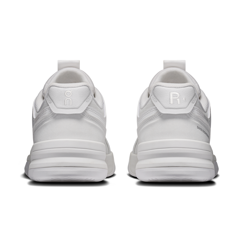 On women's running shoes heel view in white with cushioned back and logo tabs