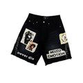 Men's black graphic carpenter shorts with distressed hem and patch prints