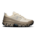 Women's waterproof low-top running shoes, cream upper with dark tread and blue logo