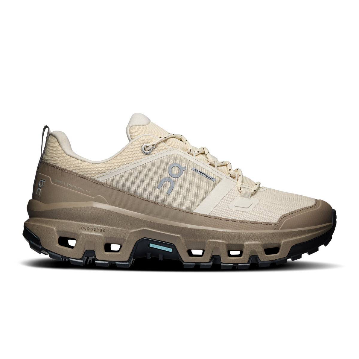 Women's waterproof low-top running shoes, cream upper with dark tread and blue logo
