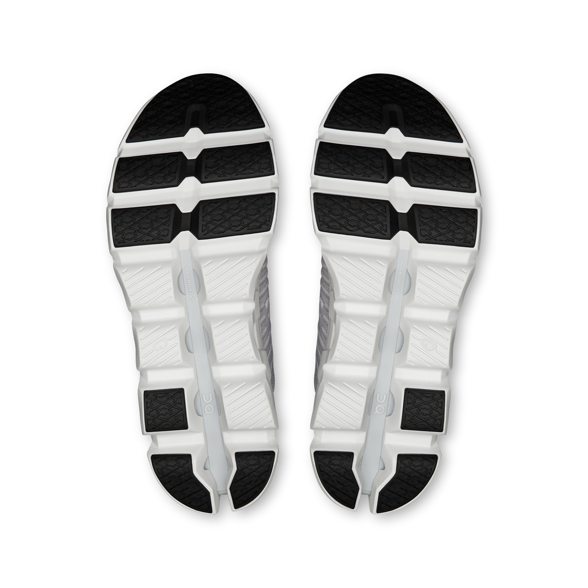 Pair of gray-and-white shoe outsoles with textured tread pattern